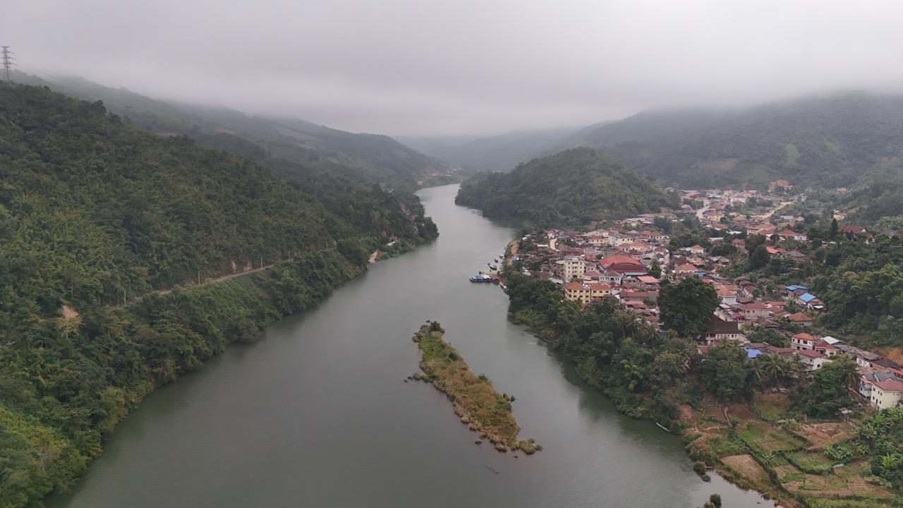 Aerial view of the Nam Ou river snaking past Muang Khua at dawn