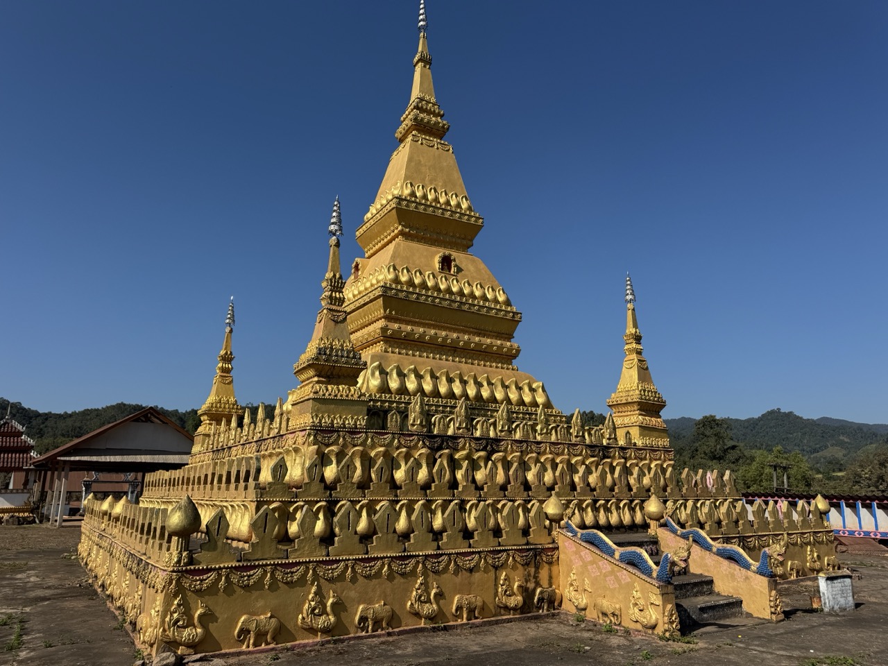 The golden Phou Sai stupa overlooking Oudomxay town